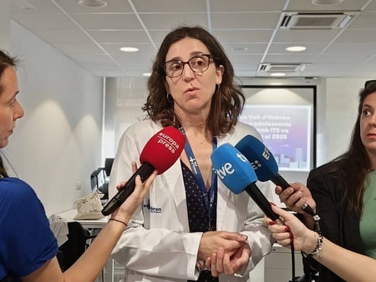 Young people talking in a clinic waiting room, representing adolescent health services