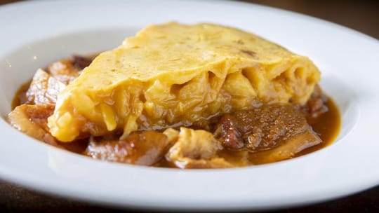 Sliced Spanish tortilla served on a plate at a Barcelona restaurant