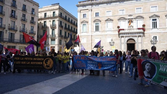 Barcelona City Hall building in Sant Jaume Square with people gathered outside.