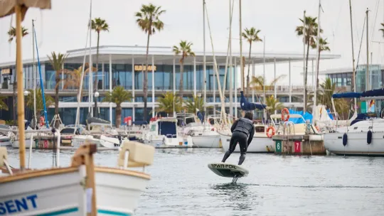 Electric boats and a jet ski displayed at Port Olímpic during the Barcelona Electric Marine Show.