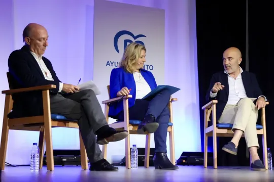 A Guardia Urbana police officer on patrol in Barcelona, possibly with a Taser stun gun visible on their belt.