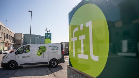 Exterior view of the High Court of Justice of Catalonia building in Barcelona, a grand historic stone structure.