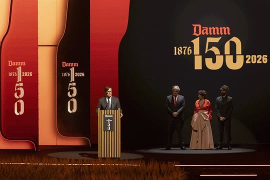 Guests attending Damm's 150th anniversary gala at the Gran Teatre del Liceu in Barcelona, with a stage performance in the bac