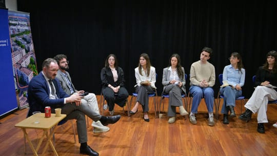 European Commissioner Dan Jørgensen and Barcelona Mayor Jaume Collboni shaking hands in a meeting room.