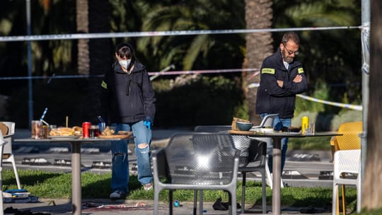 Police tape and investigation scene in Barcelona's Poblenou district following the fatal shooting of a Montenegrin fugitive
