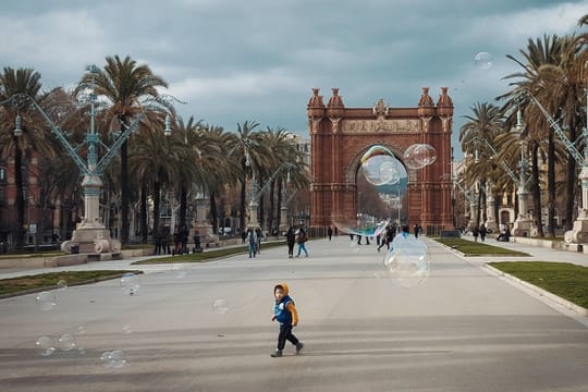 A family enjoying an interactive exhibition with colourful lights and installations in Barcelona.