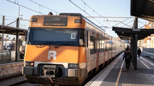 Rodalies train arriving at Barcelona Sants station platform