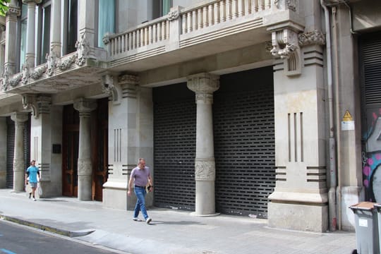 The empty, sealed ground floor of Casa Heribert Pons on Rambla de Catalunya, Barcelona, 18 months after a supermarket closure