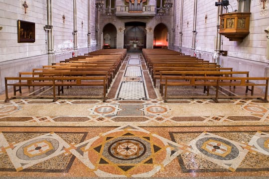 Antoni Gaudí's mosaic inside Sant Pacià church in Barcelona's Sant Andreu neighbourhood, showing geometric patterns.