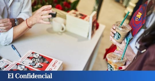 People writing in a Starbucks cafe with books on tables and Barcelona-themed decorations, showing a creative writing workshop