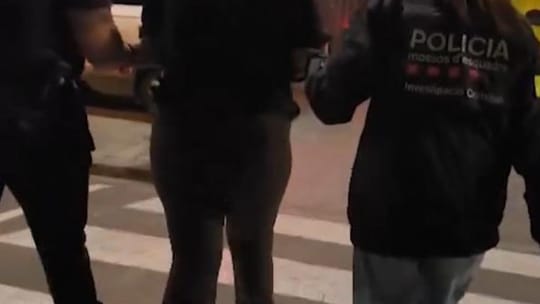 Police car with flashing lights in a Barcelona street at night