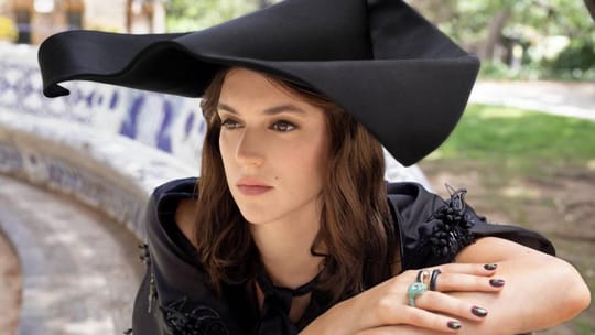Alícia Falcó poses in Dior fashion at Gaudí's Torre Bellesguard in Barcelona.