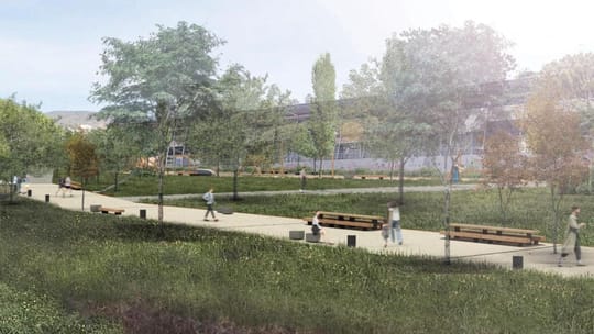 Construction site with yellow machinery and partially cleared land, indicating halted urban development for a park in Badalon