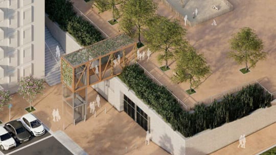 A modern glass and metal public lift structure integrated into a hillside in a residential area of Barcelona, with apartment 