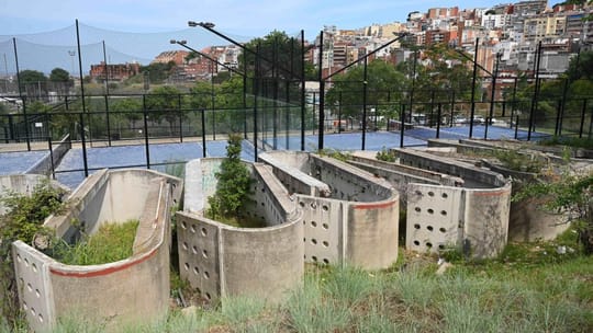 Decaying concrete structures from the former Olympic archery field in Vall d'Hebron, Barcelona, lying on a municipal plot.