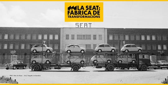 Visitors view an exhibition about SEAT's history and impact at Montjuïc Castle in Barcelona.