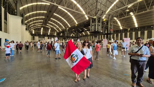 Peruvian citizens casting votes at an election booth in Barcelona.