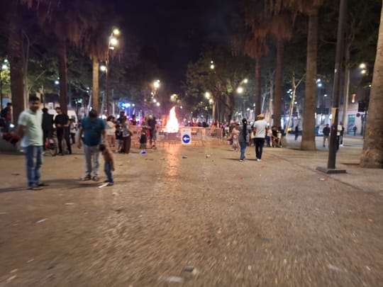 A community bonfire and street revetlla on the Rambla del Raval in Barcelona on the night of Sant Joan.