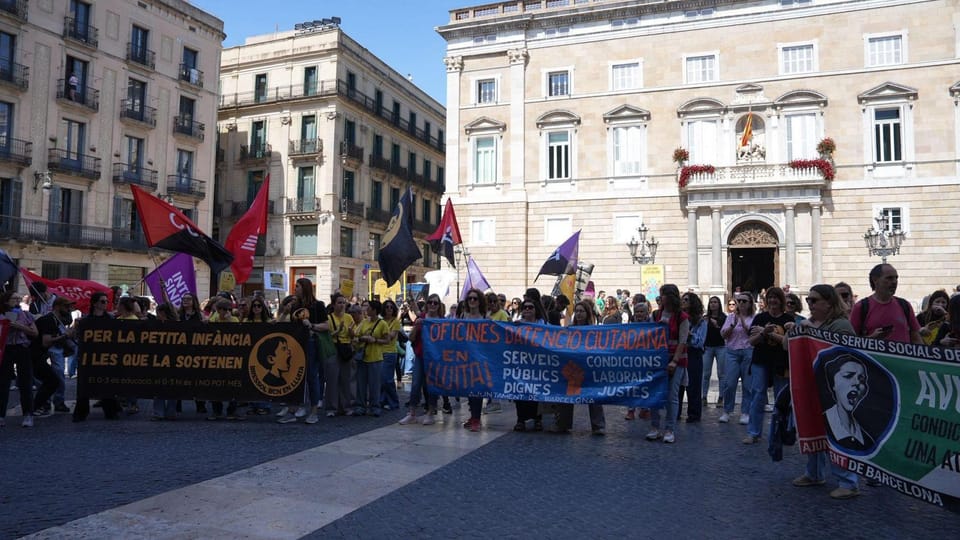 Barcelona City Hall building in Sant Jaume Square with people gathered outside.