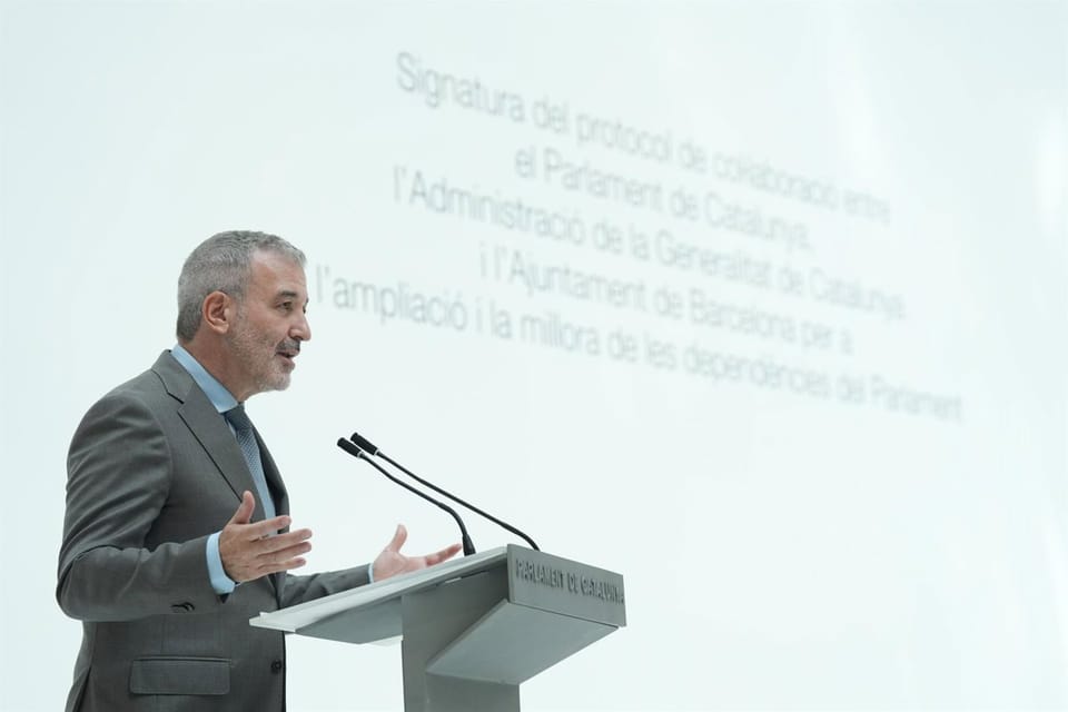 Barcelona Mayor Jaume Collboni speaking at a podium, with the city skyline in the background.