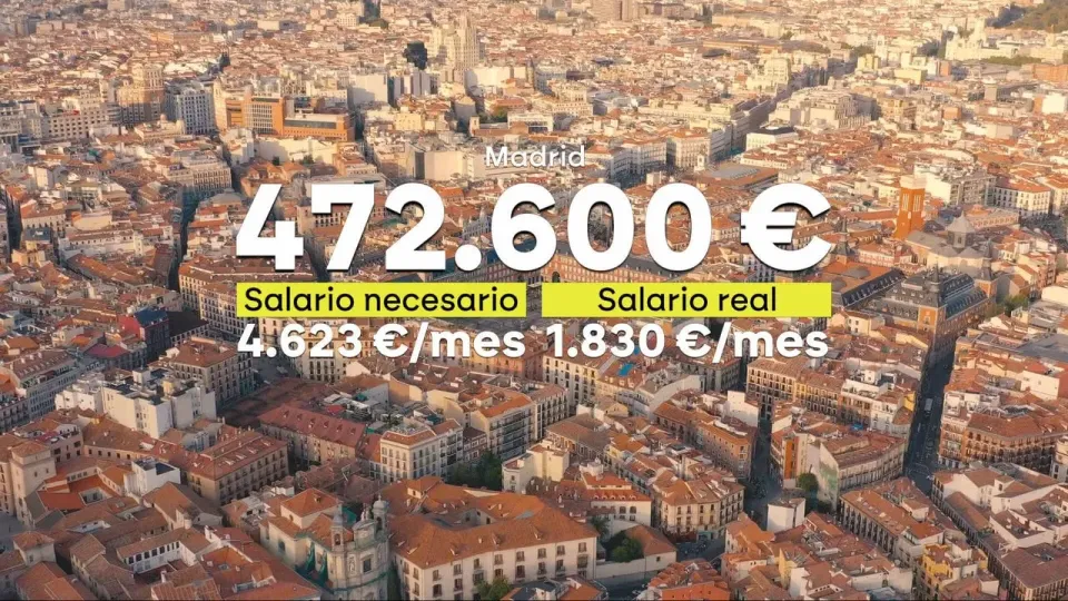 Modern apartment buildings in Barcelona's Eixample district under a clear sky, symbolising the city's property market.