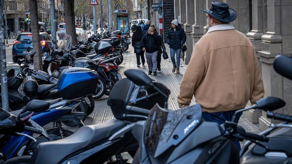 Motorbikes parked on a pavement in Barcelona's Sants-Montjuïc district