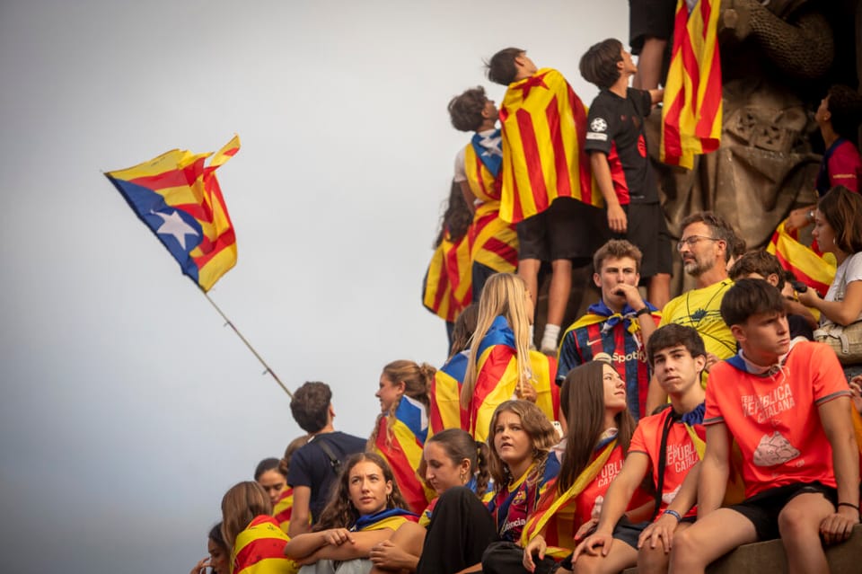 Estelada flags flying at a Catalan independence rally in Barcelona.