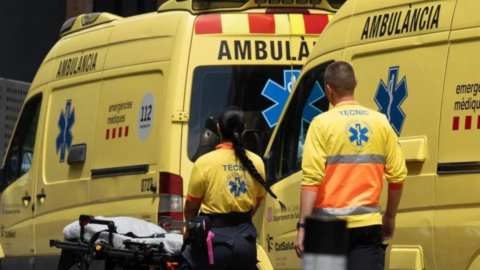 Rescue helicopters and emergency personnel at the base of Montserrat mountain after a rockfall incident.