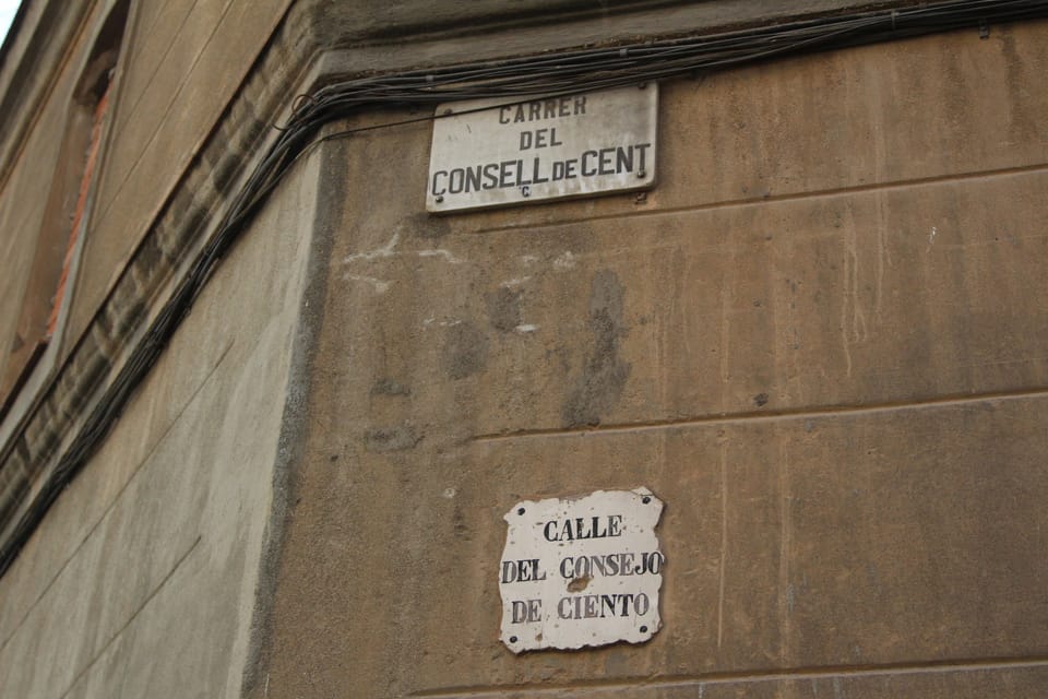 An aerial view of Consell de Cent street in Barcelona, showing its length and surrounding urban areas.