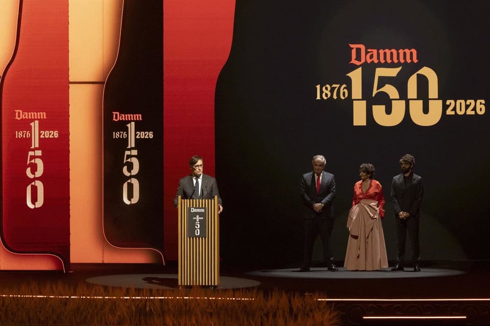 Guests attending Damm's 150th anniversary gala at the Gran Teatre del Liceu in Barcelona, with a stage performance in the bac
