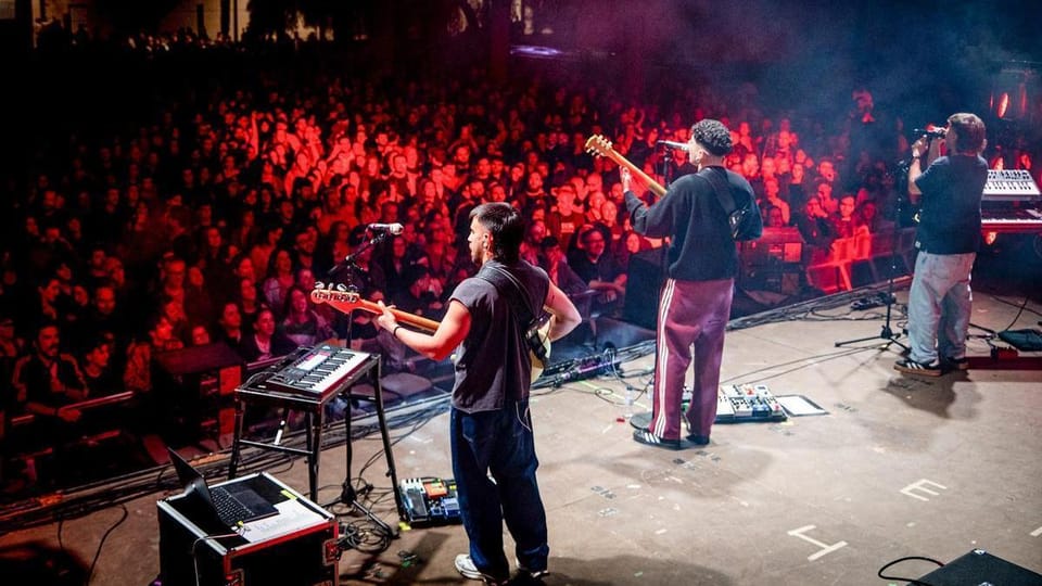 People dancing and enjoying live music at the Fiestas de Primavera in L'Hospitalet de Llobregat