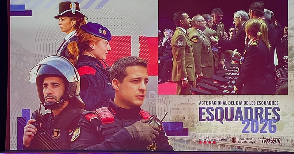 A medal being presented by a police commissioner to a military officer in uniform.