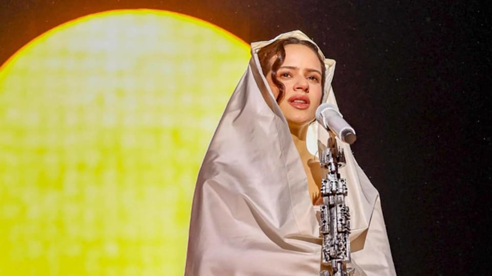 Rosalía performing on stage at Palau Sant Jordi during her Lux Tour.