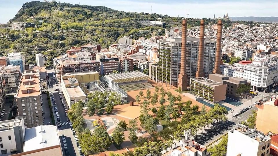 Construction workers and scaffolding surround the three tall chimneys of the Tres Xemeneies building in Barcelona's Poble Sec