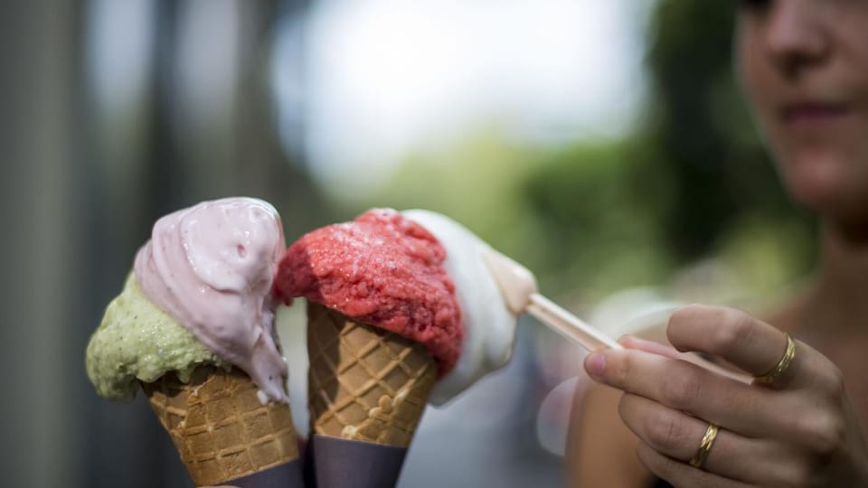 Artisanal ice cream cones with various flavours displayed at POT ice cream shop in Barcelona.
