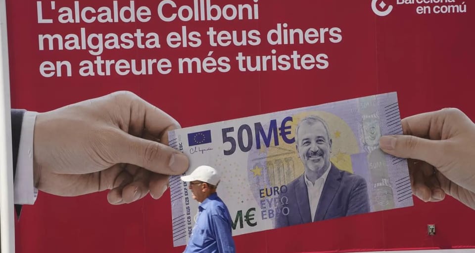 BComú's Gerardo Pisarello stands next to a truck displaying a giant €50 million note with Mayor Collboni's face.