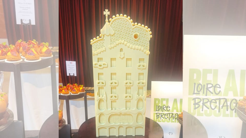 Intricately designed pastries and chocolate sculptures inspired by Antoni Gaudí's architecture, displayed at a culinary event
