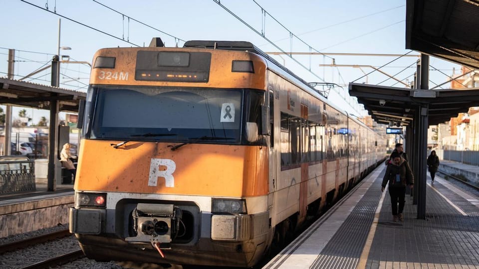 Rodalies train arriving at Barcelona Sants station platform