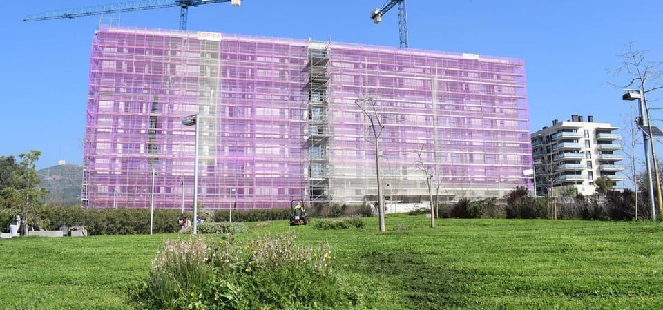 A modern social housing block with balconies in a Barcelona metropolitan area neighbourhood.