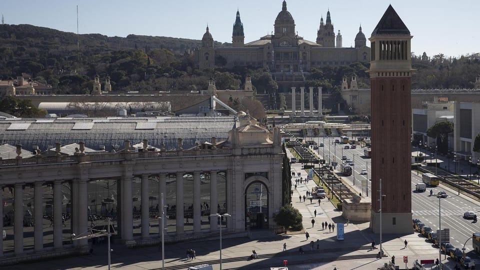 Exterior view of the Palacio de Comunicaciones y Transportes at Fira de Montjuïc, Barcelona, with its grand architectural fea