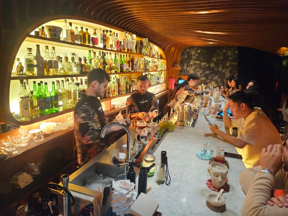 Bartenders mixing drinks at Paradiso cocktail bar in Barcelona