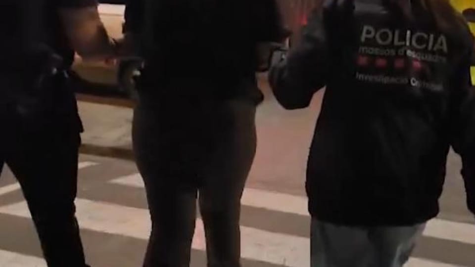 Police car with flashing lights in a Barcelona street at night