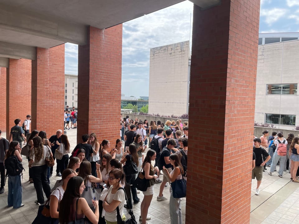 Students gather outside Universitat Politècnica de Catalunya Campus Nord before university entrance exams.