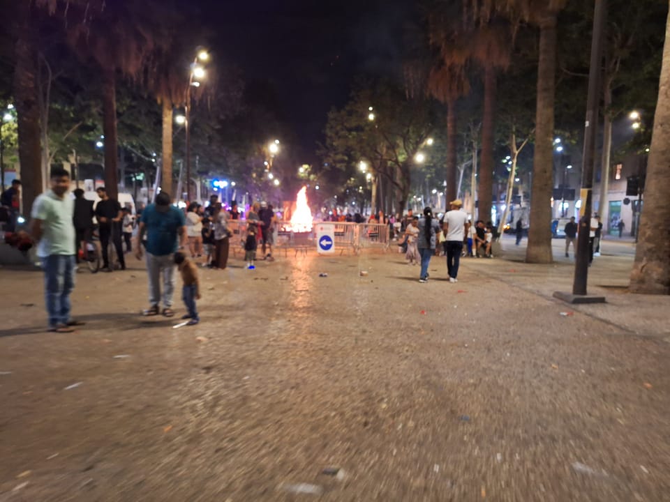 A community bonfire and street revetlla on the Rambla del Raval in Barcelona on the night of Sant Joan.