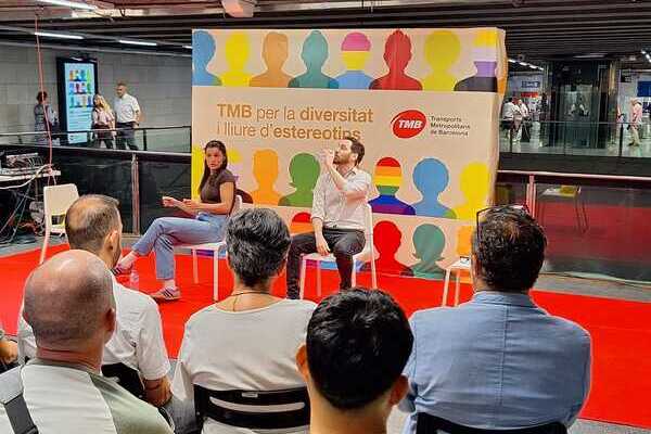 Actors performing an interactive play in a Barcelona metro station lobby, engaging with commuters.